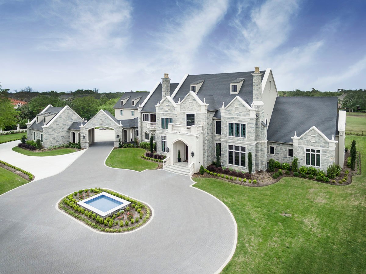 english tudor front driveway aerial view
