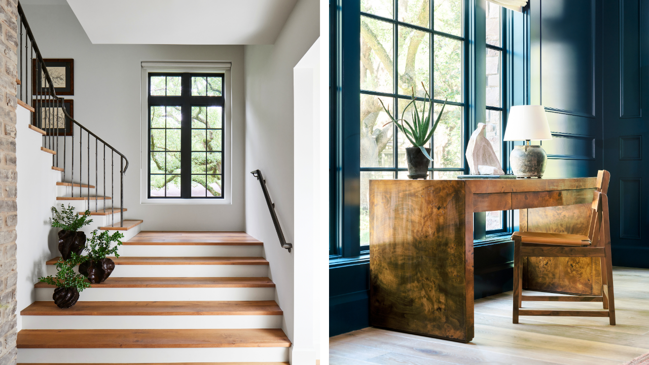 Black-framed windows in a custom home stair landing and dark blue home office.
